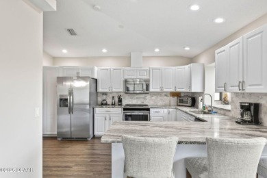 Welcome to 18 Woodhollow Lane, located in the Pine Lakes on The Grand Club - Pine Lakes Course in Florida - for sale on GolfHomes.com, golf home, golf lot