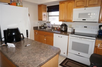 Second floor 2 Bedroom, 2 Bathroom condo with assigned covered on Saint Andrews South Golf Club in Florida - for sale on GolfHomes.com, golf home, golf lot
