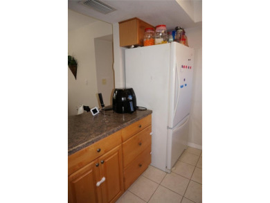 Second floor 2 Bedroom, 2 Bathroom condo with assigned covered on Saint Andrews South Golf Club in Florida - for sale on GolfHomes.com, golf home, golf lot