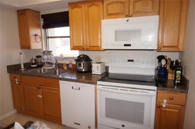 Second floor 2 Bedroom, 2 Bathroom condo with assigned covered on Saint Andrews South Golf Club in Florida - for sale on GolfHomes.com, golf home, golf lot