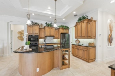 Immaculate Bonaire model with custom free form pool, amazing lot on Pelican Pointe Golf and Country Club in Florida - for sale on GolfHomes.com, golf home, golf lot