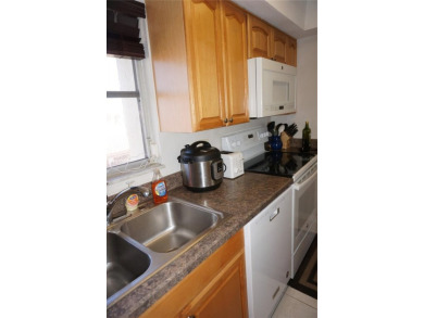 Second floor 2 Bedroom, 2 Bathroom condo with assigned covered on Saint Andrews South Golf Club in Florida - for sale on GolfHomes.com, golf home, golf lot