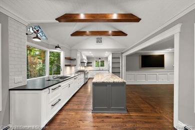 Tucked away on a wooded lot that directly backs up to McClumpha on Hilltop Golf Course in Michigan - for sale on GolfHomes.com, golf home, golf lot