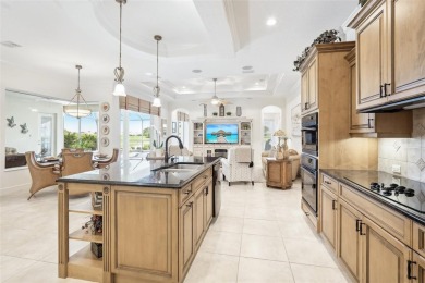 Immaculate Bonaire model with custom free form pool, amazing lot on Pelican Pointe Golf and Country Club in Florida - for sale on GolfHomes.com, golf home, golf lot