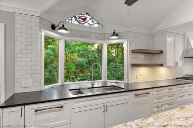 Tucked away on a wooded lot that directly backs up to McClumpha on Hilltop Golf Course in Michigan - for sale on GolfHomes.com, golf home, golf lot
