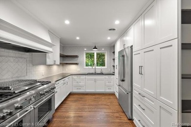 Tucked away on a wooded lot that directly backs up to McClumpha on Hilltop Golf Course in Michigan - for sale on GolfHomes.com, golf home, golf lot