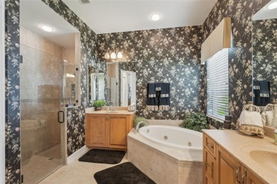 Immaculate Bonaire model with custom free form pool, amazing lot on Pelican Pointe Golf and Country Club in Florida - for sale on GolfHomes.com, golf home, golf lot