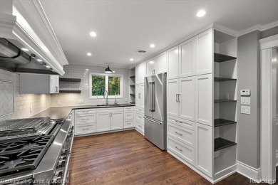 Tucked away on a wooded lot that directly backs up to McClumpha on Hilltop Golf Course in Michigan - for sale on GolfHomes.com, golf home, golf lot