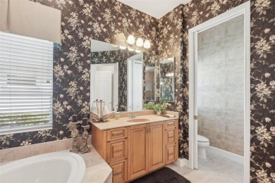 Immaculate Bonaire model with custom free form pool, amazing lot on Pelican Pointe Golf and Country Club in Florida - for sale on GolfHomes.com, golf home, golf lot