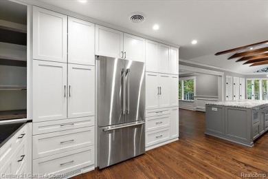 Tucked away on a wooded lot that directly backs up to McClumpha on Hilltop Golf Course in Michigan - for sale on GolfHomes.com, golf home, golf lot