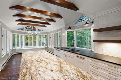 Tucked away on a wooded lot that directly backs up to McClumpha on Hilltop Golf Course in Michigan - for sale on GolfHomes.com, golf home, golf lot