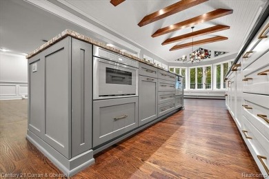 Tucked away on a wooded lot that directly backs up to McClumpha on Hilltop Golf Course in Michigan - for sale on GolfHomes.com, golf home, golf lot