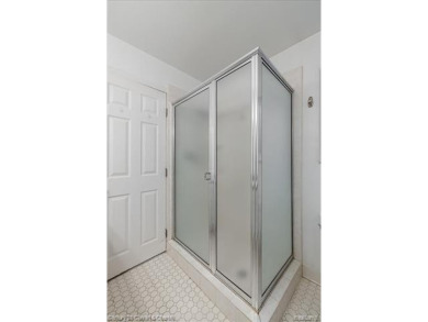 Tucked away on a wooded lot that directly backs up to McClumpha on Hilltop Golf Course in Michigan - for sale on GolfHomes.com, golf home, golf lot