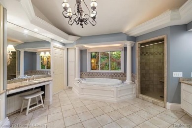 Tucked away on a wooded lot that directly backs up to McClumpha on Hilltop Golf Course in Michigan - for sale on GolfHomes.com, golf home, golf lot