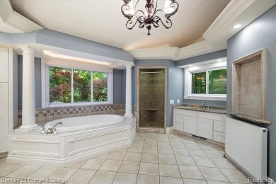 Tucked away on a wooded lot that directly backs up to McClumpha on Hilltop Golf Course in Michigan - for sale on GolfHomes.com, golf home, golf lot
