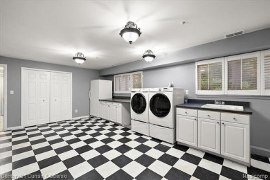 Tucked away on a wooded lot that directly backs up to McClumpha on Hilltop Golf Course in Michigan - for sale on GolfHomes.com, golf home, golf lot