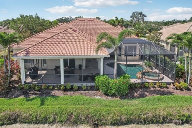 Immaculate Bonaire model with custom free form pool, amazing lot on Pelican Pointe Golf and Country Club in Florida - for sale on GolfHomes.com, golf home, golf lot