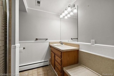 Tucked away on a wooded lot that directly backs up to McClumpha on Hilltop Golf Course in Michigan - for sale on GolfHomes.com, golf home, golf lot