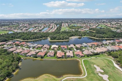 Immaculate Bonaire model with custom free form pool, amazing lot on Pelican Pointe Golf and Country Club in Florida - for sale on GolfHomes.com, golf home, golf lot