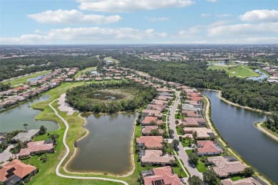 Immaculate Bonaire model with custom free form pool, amazing lot on Pelican Pointe Golf and Country Club in Florida - for sale on GolfHomes.com, golf home, golf lot