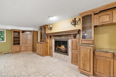 Tucked away on a wooded lot that directly backs up to McClumpha on Hilltop Golf Course in Michigan - for sale on GolfHomes.com, golf home, golf lot