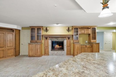 Tucked away on a wooded lot that directly backs up to McClumpha on Hilltop Golf Course in Michigan - for sale on GolfHomes.com, golf home, golf lot