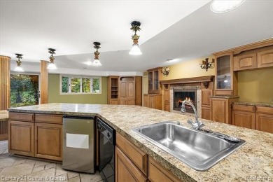 Tucked away on a wooded lot that directly backs up to McClumpha on Hilltop Golf Course in Michigan - for sale on GolfHomes.com, golf home, golf lot