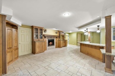 Tucked away on a wooded lot that directly backs up to McClumpha on Hilltop Golf Course in Michigan - for sale on GolfHomes.com, golf home, golf lot