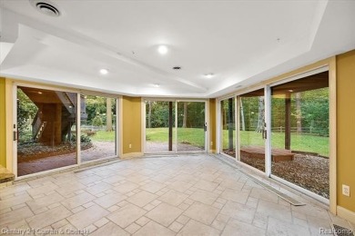 Tucked away on a wooded lot that directly backs up to McClumpha on Hilltop Golf Course in Michigan - for sale on GolfHomes.com, golf home, golf lot