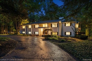 Tucked away on a wooded lot that directly backs up to McClumpha on Hilltop Golf Course in Michigan - for sale on GolfHomes.com, golf home, golf lot