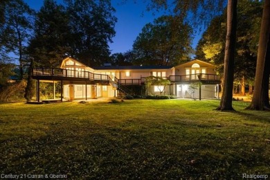 Tucked away on a wooded lot that directly backs up to McClumpha on Hilltop Golf Course in Michigan - for sale on GolfHomes.com, golf home, golf lot