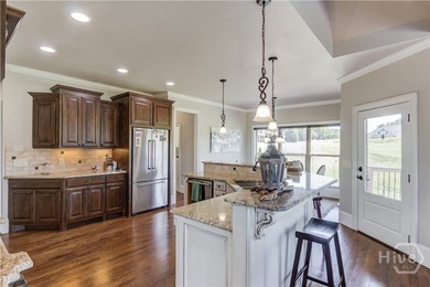 Discover unparalleled luxury at 1776 Traditions Way, an on Traditions of Braselton Golf Club in Georgia - for sale on GolfHomes.com, golf home, golf lot