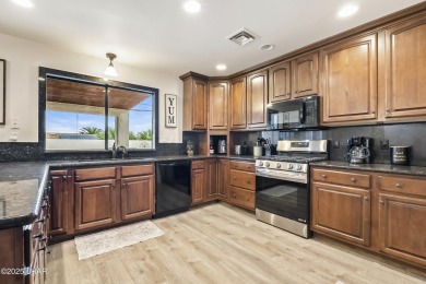 This beautifully updated 5-bedroom, 4-bathroom home in Lake on London Bridge Golf Course in Arizona - for sale on GolfHomes.com, golf home, golf lot