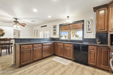 This beautifully updated 5-bedroom, 4-bathroom home in Lake on London Bridge Golf Course in Arizona - for sale on GolfHomes.com, golf home, golf lot