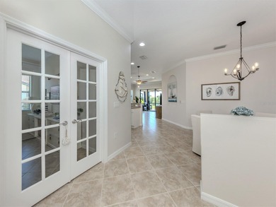 This meticulously maintained, WCI-built residence nestled in the on Sarasota National Golf Club in Florida - for sale on GolfHomes.com, golf home, golf lot