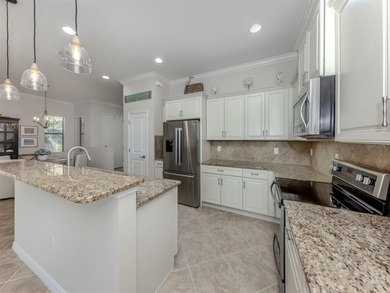 This meticulously maintained, WCI-built residence nestled in the on Sarasota National Golf Club in Florida - for sale on GolfHomes.com, golf home, golf lot