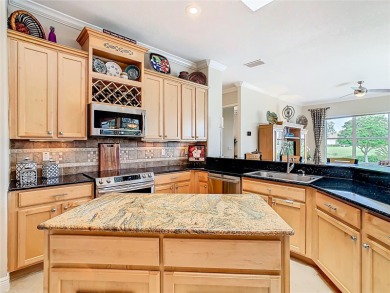 ABSOLUTELY STUNNING Operetta model with a SALT WATER POOL on a on Poinciana Golf Club in Florida - for sale on GolfHomes.com, golf home, golf lot