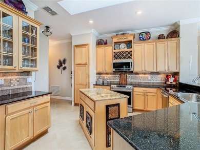ABSOLUTELY STUNNING Operetta model with a SALT WATER POOL on a on Poinciana Golf Club in Florida - for sale on GolfHomes.com, golf home, golf lot