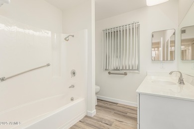 Fully updated Sun City home offering 3 bedrooms, 2 baths, and 1 on Sun City Lakes West and East in Arizona - for sale on GolfHomes.com, golf home, golf lot