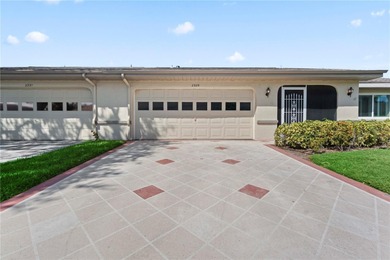Welcome home to this spacious 2-bedroom, 2-bath residence that on Falcon Watch Golf Club in Florida - for sale on GolfHomes.com, golf home, golf lot