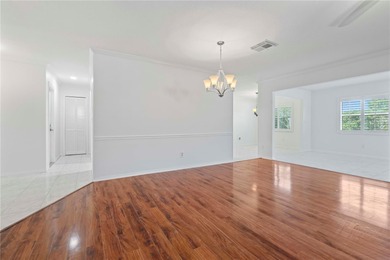 Welcome home to this spacious 2-bedroom, 2-bath residence that on Falcon Watch Golf Club in Florida - for sale on GolfHomes.com, golf home, golf lot