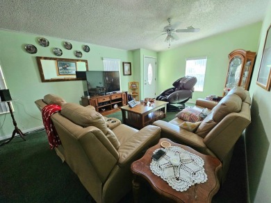This home is on leased land. Buyers do not own the land. This on Big Cypress Golf and Country Club in Florida - for sale on GolfHomes.com, golf home, golf lot