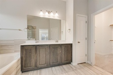 Beautifully maintained single-story home offering 3 bedrooms, 2 on The Golf Club At Champions Circle in Texas - for sale on GolfHomes.com, golf home, golf lot