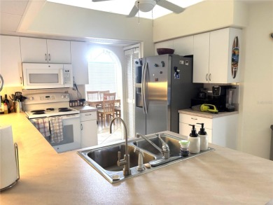 This is a rare opportunity to buy a turnkey (yes- everything is on Pinemoor West Golf Club in Florida - for sale on GolfHomes.com, golf home, golf lot