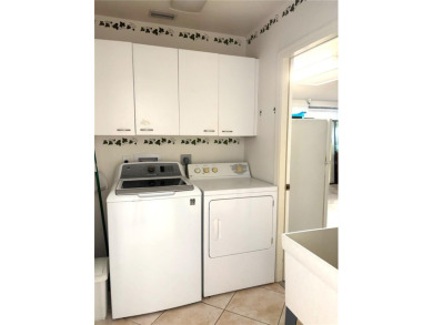 This is a rare opportunity to buy a turnkey (yes- everything is on Pinemoor West Golf Club in Florida - for sale on GolfHomes.com, golf home, golf lot