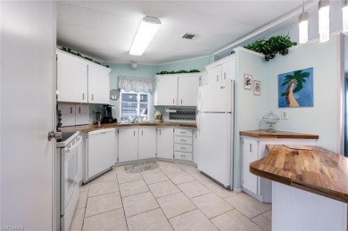 This stylish 2BR/2BA home features a spacious 240 s/f glass on Riviera Golf Club in Florida - for sale on GolfHomes.com, golf home, golf lot
