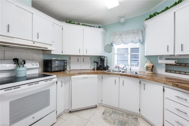 This stylish 2BR/2BA home features a spacious 240 s/f glass on Riviera Golf Club in Florida - for sale on GolfHomes.com, golf home, golf lot