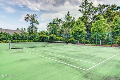 Exquisite home with a view of the pond located in the on Cape Fear National At Brunswick Forest in North Carolina - for sale on GolfHomes.com, golf home, golf lot