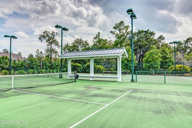 Exquisite home with a view of the pond located in the on Cape Fear National At Brunswick Forest in North Carolina - for sale on GolfHomes.com, golf home, golf lot