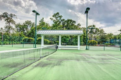 Exquisite home with a view of the pond located in the on Cape Fear National At Brunswick Forest in North Carolina - for sale on GolfHomes.com, golf home, golf lot